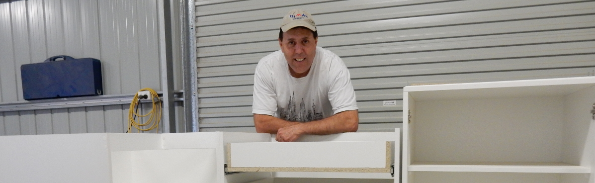 John from John's Cabinets with a kitchen drawer unit-in-progress.
